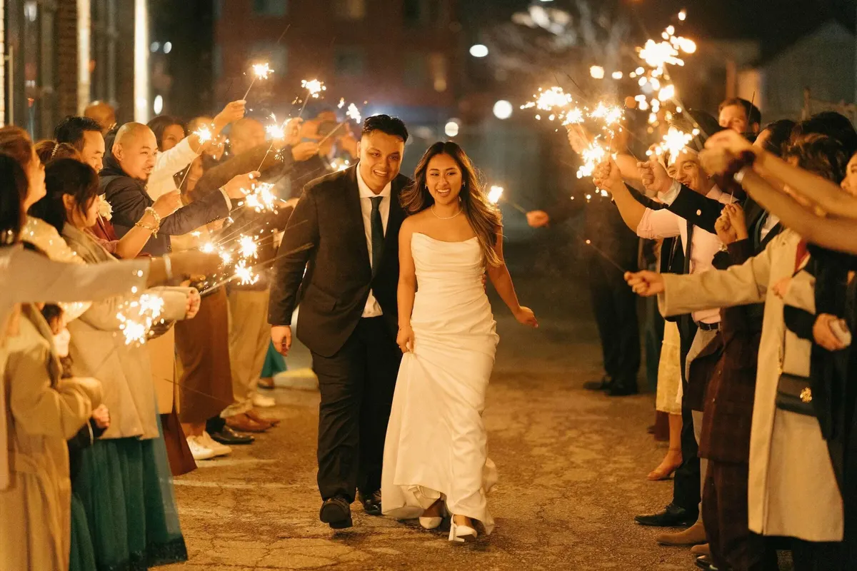 Toronto wedding couple walks through a sparkler send-off
